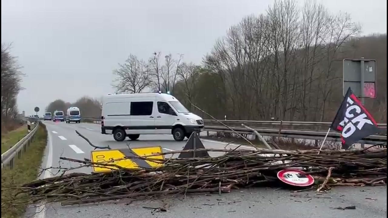 [Video] Police in Giessen, Germany, stand idle as ANTIFA erects roadblocks
