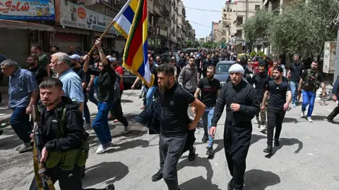 Deadly Clashes Erupt Between Druze Militants and Syrian Forces in As-Suwayda