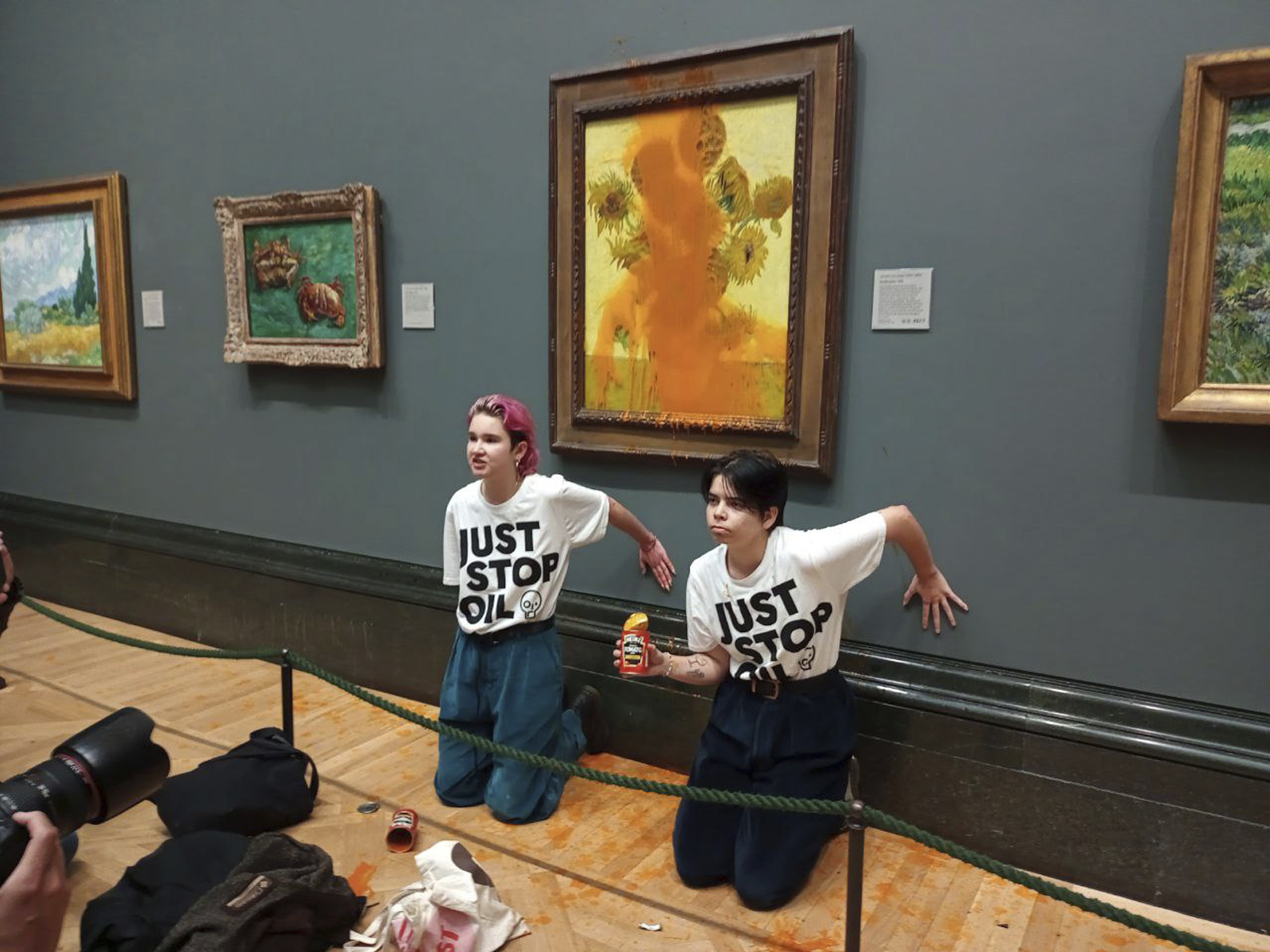 Climate protesters in London throw soup on Van Gogh's ...