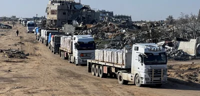 Israel to halve aid trucks to Gaza, citing Hamas ceasefire violations