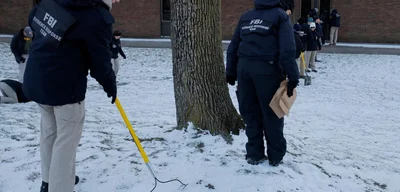 Suspect linked to Brown University shooting and MIT professor murder