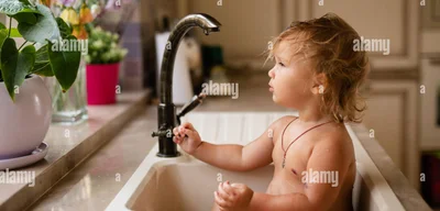 Images reveal baby playing in a sink, not published out of respect