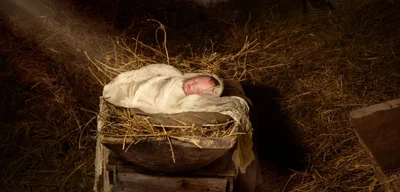 Jesus was laid in a manger, a feeding trough for sacrificial lambs