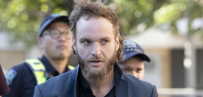 Joel Davis faces human rights abuses in prison, charged six times for podcast