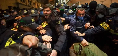 Protesters march towards Georgian Dream Party office in Tbilisi