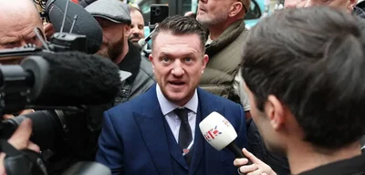 Tommy Robinson found not guilty of terror offence for not giving police phone access