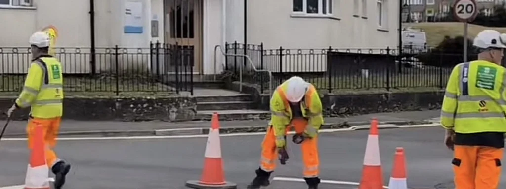 Plymouth Roundabout Repainted White, Locals Respond with Red Cross