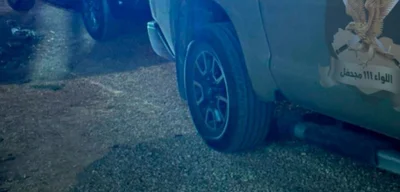 Andriy Bayuk's vehicle parked outside Prime Minister Dbeibah's residency