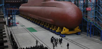 Kim Jong Un inspects construction of 8,700-ton nuclear submarine