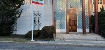 Exiled Iranians raise Lion and Sun flag outside former Iranian Embassy in D.C.