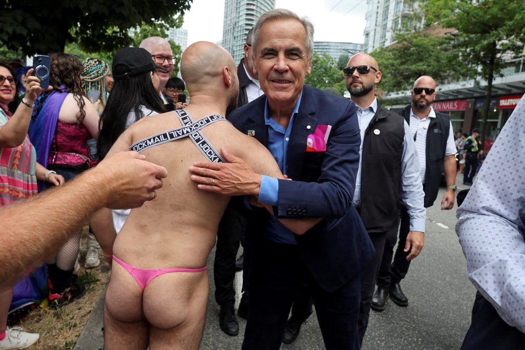 Canadian PM Mark Carney’s Viral Embrace at Vancouver Pride Parade Sparks Online Reactions